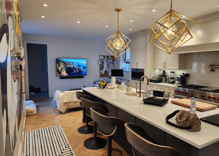 Open kitchen with pendant lighting and integrated display